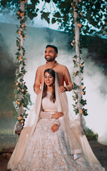 Load image into Gallery viewer, CELESTIAL OPULENCE: THE RESPLENDENT RICH CREAM TULLE SILK LEHENGA BY TANU KHERA DESIGNS"