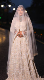 Load image into Gallery viewer, Ivory Opulence: Tanu Khera's Majestic Reception Lehenga with Exquisite Embroidery