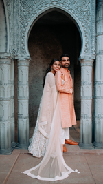 Load image into Gallery viewer, CELESTIAL OPULENCE: THE RESPLENDENT RICH CREAM TULLE SILK LEHENGA BY TANU KHERA DESIGNS&quot;
