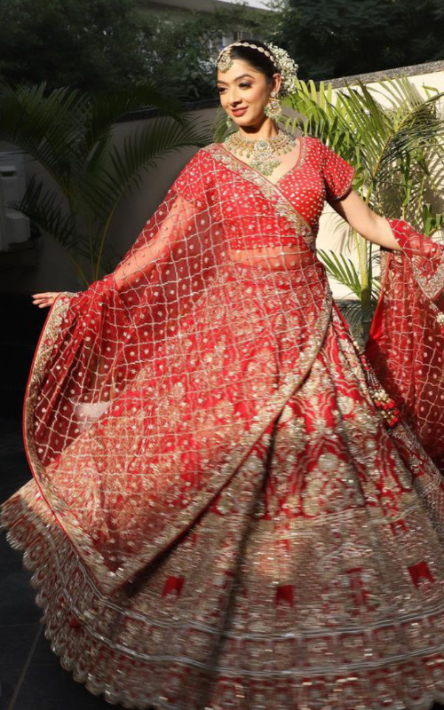 "Exquisite Grandeur: The Multicoloured Bridal Velvet Lehnga by Tanu Khera Designs"