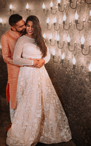 CELESTIAL OPULENCE: THE RESPLENDENT RICH CREAM TULLE SILK LEHENGA BY TANU KHERA DESIGNS