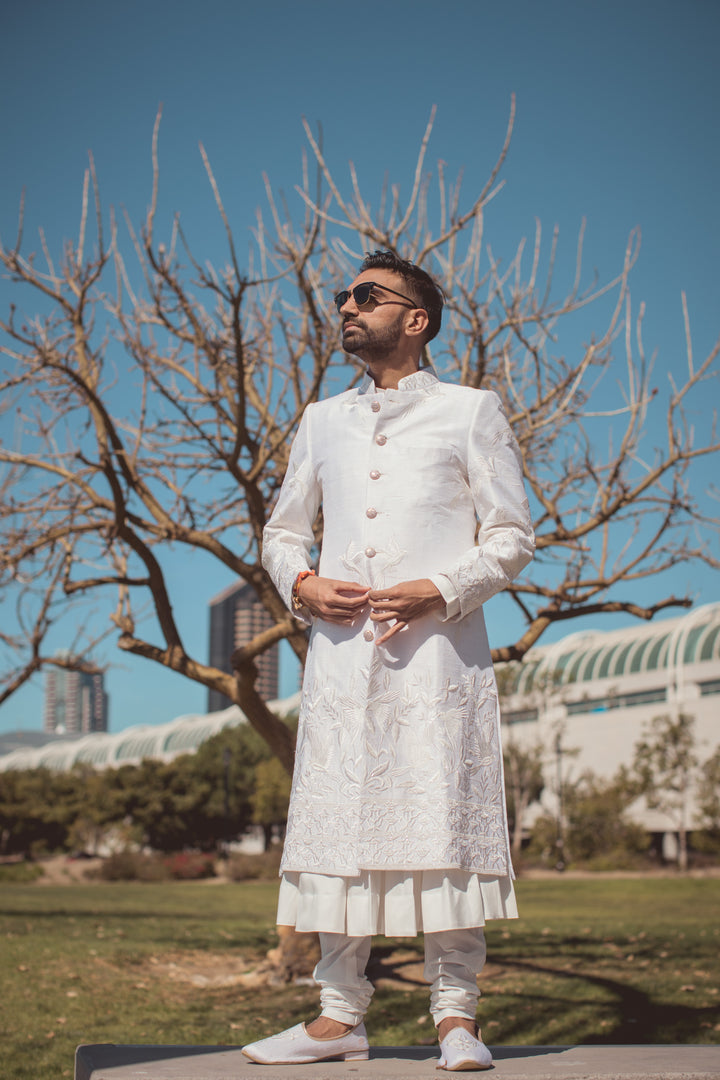 "EMBELLISHED EXCELLENCE MAJESTIC THREADS: TANU KHERA'S ROYAL OFF-WHITE SHERWANI"