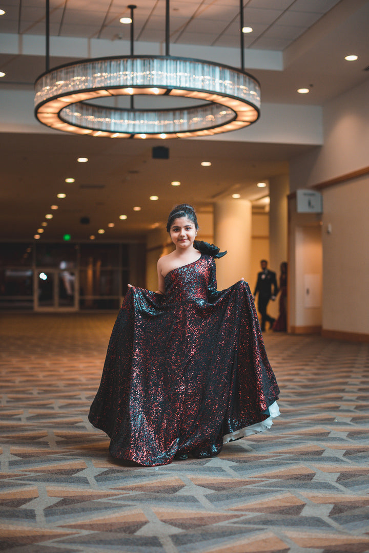 "BLOOMS OF RADIANCE: THE TANU KHERA DESIGNS ONE-SHOULDER SEQUINS GOWN WITH SAHIN FLOWER"