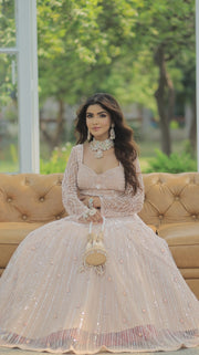 Majestic Splendor: Peach Net Lehenga with Sequins, Beads, Crystals, and Stone Embroidery