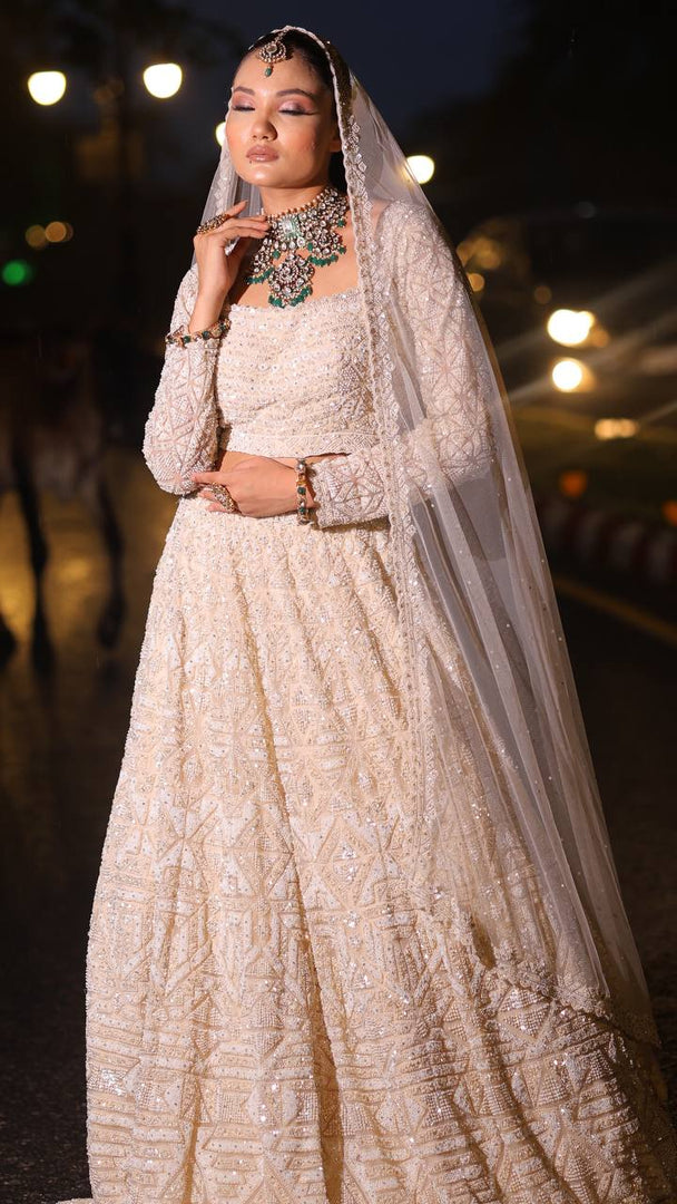 Ivory Opulence: Tanu Khera's Majestic Reception Lehenga with Exquisite Embroidery