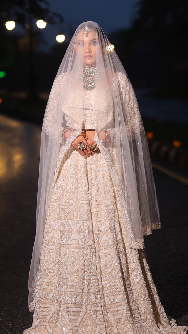 Ivory Opulence: Tanu Khera's Majestic Reception Lehenga with Exquisite Embroidery