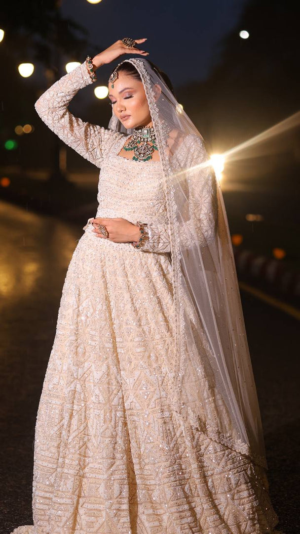 Ivory Opulence: Tanu Khera's Majestic Reception Lehenga with Exquisite Embroidery