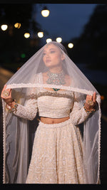 Load image into Gallery viewer, Ivory Opulence: Tanu Khera&#39;s Majestic Reception Lehenga with Exquisite Embroidery
