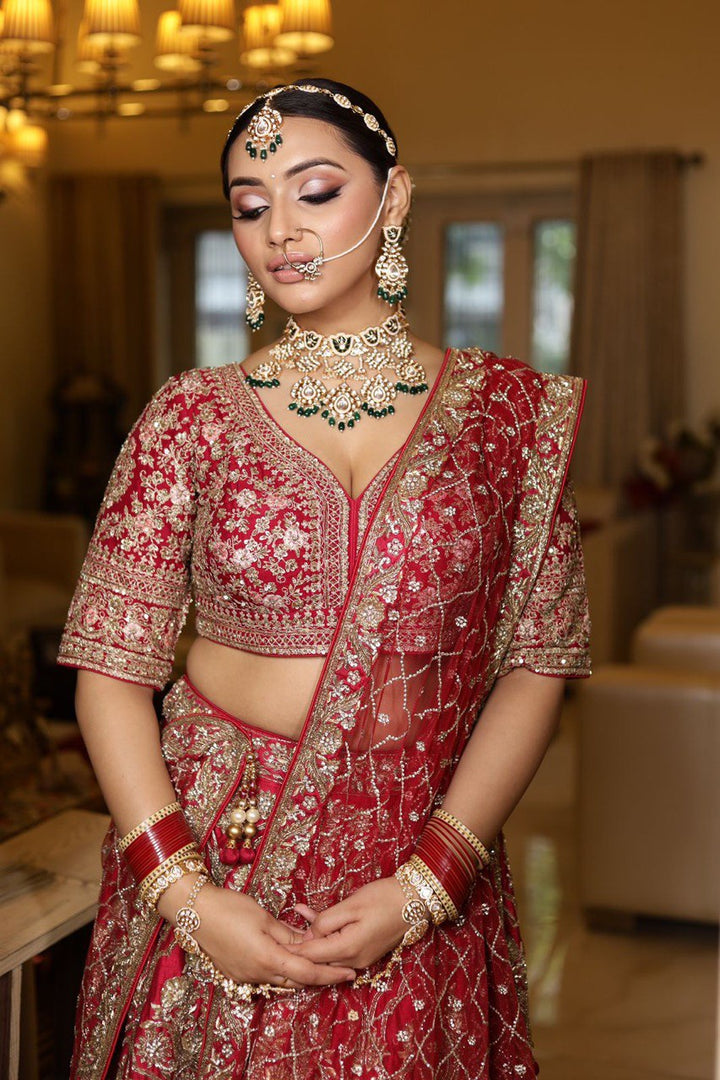 "Antique Royalty: A Masterpiece of Gold and Red Bridal Couture"