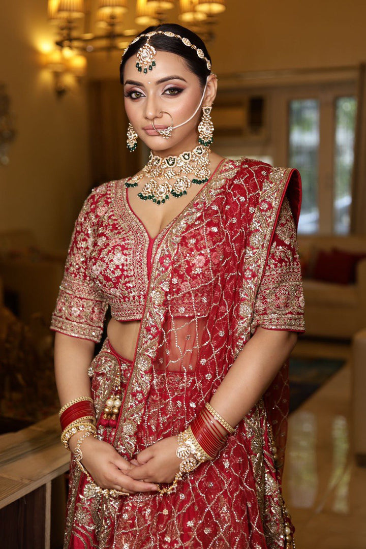 "Antique Royalty: A Masterpiece of Gold and Red Bridal Couture"