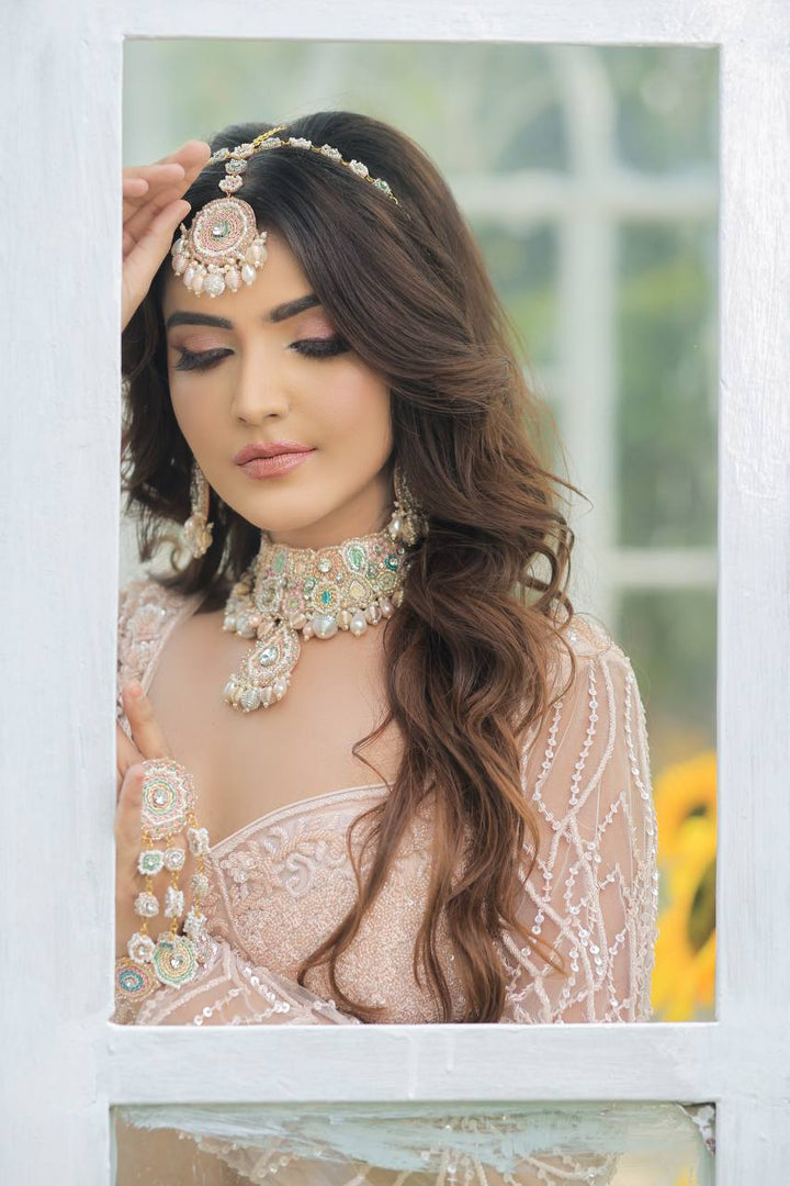 Majestic Splendor: Peach Net Lehenga with Sequins, Beads, Crystals, and Stone Embroidery